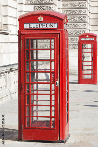 Naklejka dekoracyjna Two Vintage Red London Telephone Booths.