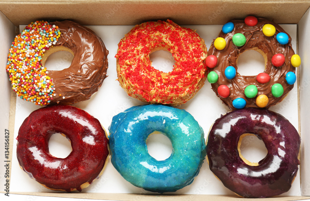 Delicious donuts in box, closeup
