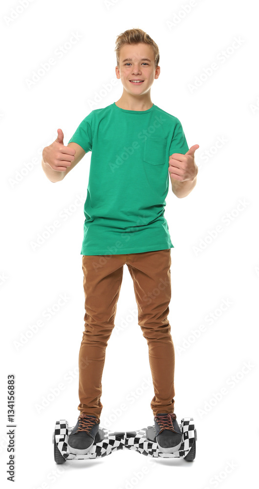 Teenager riding on gyroscooter against white background