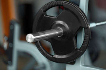 Canvas Print - Barbell on rack in gym, close up