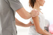 © Africa Studio - Physiotherapist working with patient in clinic, closeup
