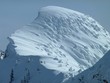 Massive cornice on the head wall above Fernie Alpine Resort looks like a frozen wave.