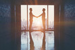 Businessmen handshake after the trade agreement in office on the building.
(silhouette)