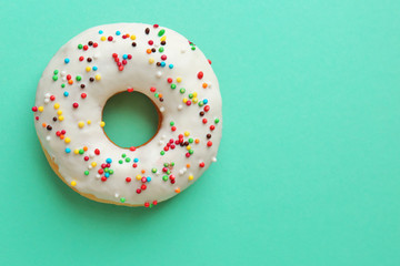 Canvas Print - Delicious donut on color background