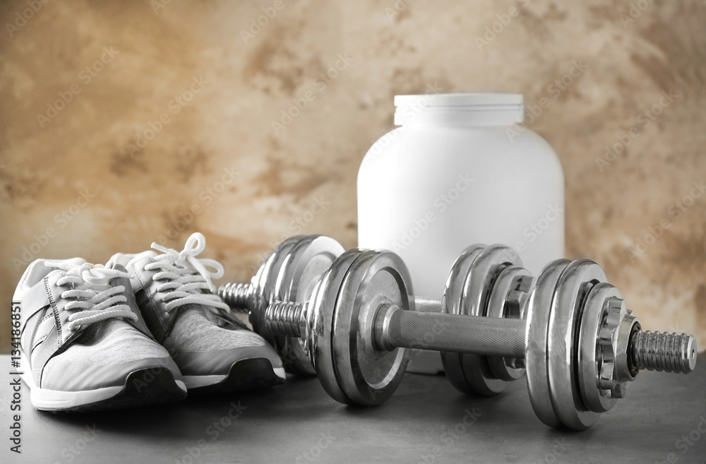Sports concept. Workout objects on grey background