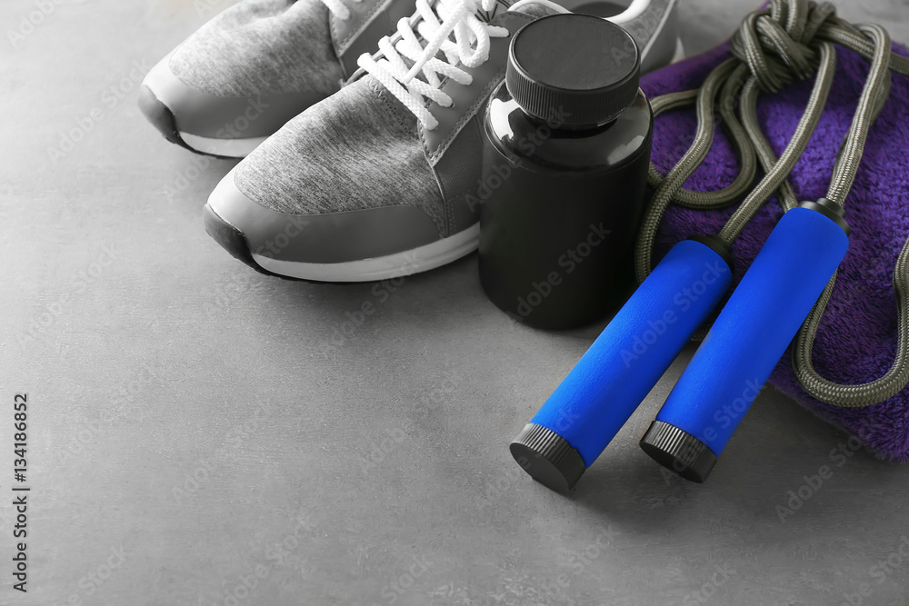 Sports concept. Workout objects on grey background