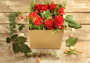 Poster - Beautiful roses in gift box on wooden background