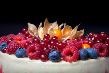 Biscuit homemade cake with cream and berries. Toned