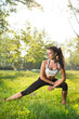 © Bojan - Fitness woman doing streching during outdoor cross training workout.