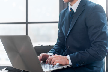 businessman working and using laptop in office.