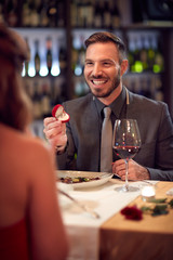 Wall Mural - Man engaged woman in restaurant