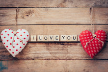 Heart Fabric And Wooden Text I LOVE YOU On Wooden Table Backgrou
