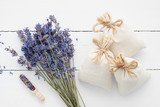 Fototapeta Lawenda - Bouquet of dry lavender flowers and sachets 