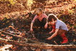 © RooM The Agency - two boys playing in mud by a river