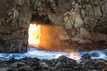 Winter Solstice Light Beam Through A Sea Cave Tunnel On Pfeiffer Beach