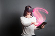 © Manuel - young woman using virtual reality glasses and a tablet computer