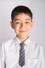 Wall Mural - Portrait of little boy wear white shirt school uniform