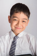 Wall Mural - Portrait of little boy wear white shirt school uniform