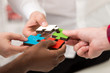 © FS-Stock - business people group assembling jigsaw puzzle and represent team support