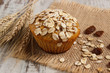 Fresh muffin with oatmeal baked with wholemeal flour and ears of rye grain, delicious healthy dessert