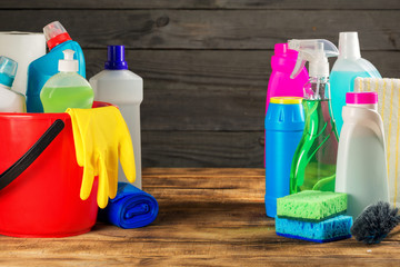 Cleaning product on wooden table, close up with copy space