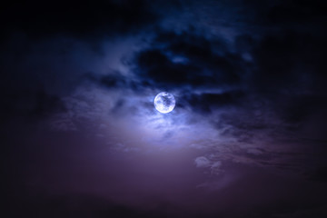 Wall Mural - nighttime sky with clouds and bright full moon with shiny.