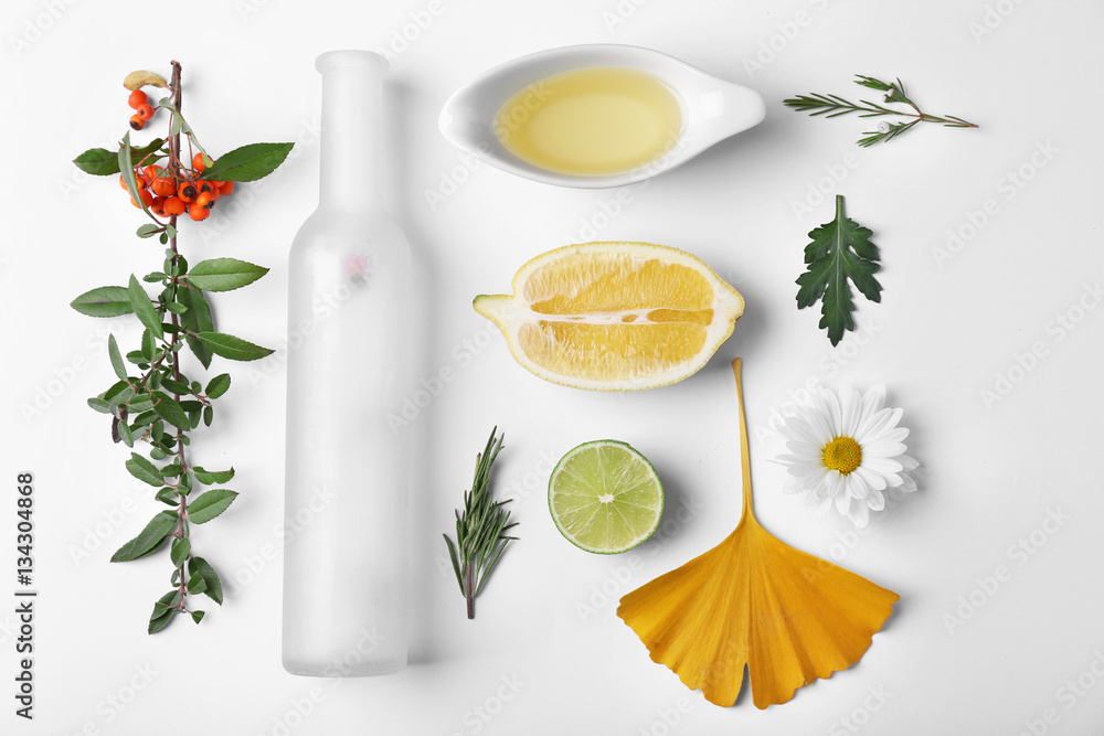 Natural cosmetic ingredients on white background, top view