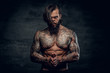 © Fxquadro - Portrait of a  man with tattooed body.