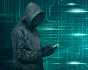 Wall Mural - Hacker with mask touching a smartphone screen