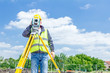 © Roman_23203 - Geodesist is working with total station on a building site. Civi