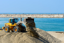 Bulldozer Working On A Beach