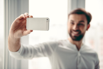 Poster - Handsome man with gadget