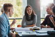 © Jacob Lund - Smiling young woman with classmates in library