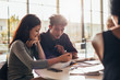 © Jacob Lund - University students studying together in class.