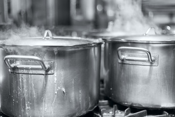 The big pot of boiling soup black and white photo