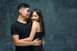 © master1305 - Portrait of smiling Korean couple on a gray