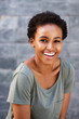 © mimagephotos - attractive young black woman smiling with t-shirt