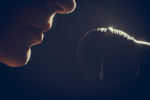 Woman Singing To Microphone