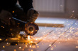 © Maksim Kostenko - Cutting metal with angle grinder.