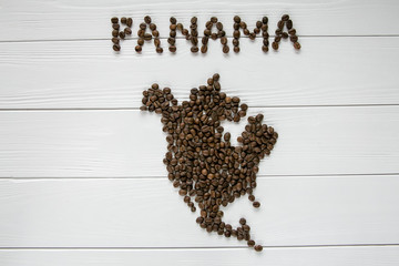  Map of the Panama made of roasted coffee beans laying on white wooden textured background. Space for text. 