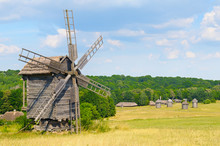 Old Wooden Windmill In A Field