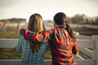 © Erickson Stock - Two farm workers look at the view.