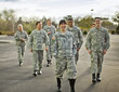 © Erickson Stock - Group of US smiling army soldiers walking outdoors