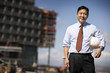 © Erickson Stock - Portrait of engineer with hardhat standing at construction site