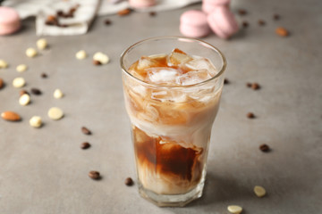 Canvas Print - Glass of cold coffee with milk on table