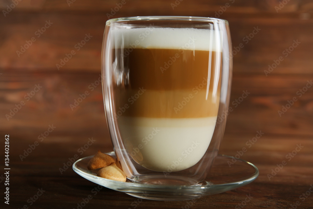 Cup of coffee on wooden background