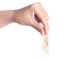 Hand Sprinkling Cayenne Pepper,cayenne Pepper On White 