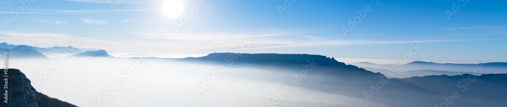 Obraz na płótnie beautiful french alps winter panoramic aerial view landscape with a fantastic blue haze cloudy mountain background w salonie