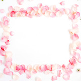 Fototapeta Tulipany - Frame made of pink roses petals on white background. Flat lay, top view. Valentine's background