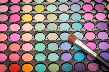 Beauty background with makeup brush and palette